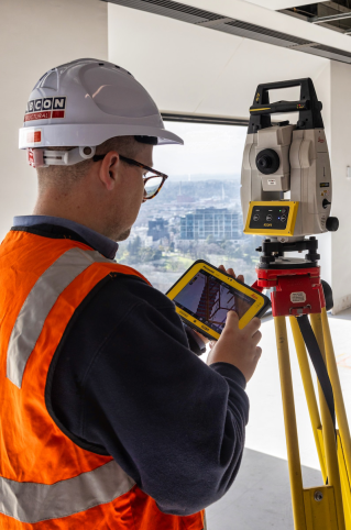 <em>David Lewis, project surveyor and draftsman, Fabcon, viewing data and stake out directly from the IFC model onsite.</em>