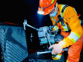 Engineer using a robot in the mines
